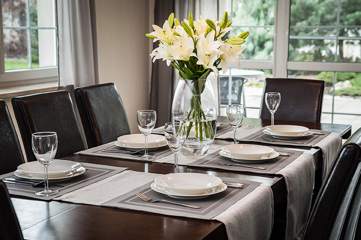Beautifully set table in gray hues. Keep the focus on your home.